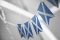 A garland of Scotland national flags on an abstract blurred background Royalty Free Stock Photo