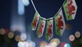 A garland of Wales national flags on an abstract blurred background Royalty Free Stock Photo