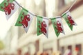 A garland of Wales national flags on an abstract blurred background Royalty Free Stock Photo