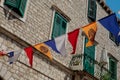 Garlands of colorful flags in the street of Sibenik