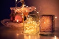 Garlands and decorations, Golden lights on a wire, a candlestick, a vase and other