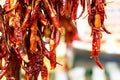 Garlands of dry red chilly peppers selective fokus Royalty Free Stock Photo