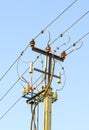 Garlands of insulators of a high-voltage power line, on a concrete support. Close-up. Russia. Siberia Royalty Free Stock Photo