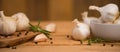 Garlic banner, background. Spices, Bulbs of garlic on a wooden rustic table in the shape of a panorama. A bunch of garlic peeled Royalty Free Stock Photo