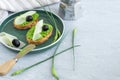 Garlic bread. Baguette slices with garlic butter olives cheese and garlic arrows in green plate Royalty Free Stock Photo
