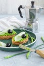 Garlic bread. Baguette slices with garlic butter olives cheese and garlic arrows in green plate Royalty Free Stock Photo
