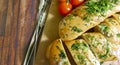 Garlic bread ruddy on a wooden board, cherry Royalty Free Stock Photo