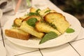 Garlic bread with sweet basil in white dish Royalty Free Stock Photo