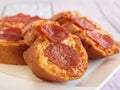 GARLIC BREAD TOPPED WITH CHEESE AND PEPPERONI served in dish isolated wooden table top view arabic food appetizer Royalty Free Stock Photo