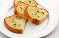 Garlic bread in white plate, cut out on white background