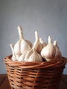 Garlic in a brown bamboo wicker basket Royalty Free Stock Photo