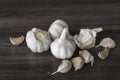 Garlic bulbs on wooden table. Royalty Free Stock Photo