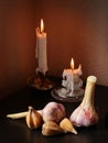 Garlic bulbs and candles