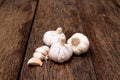 Garlic bulbs and cloves on wooden table Royalty Free Stock Photo