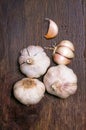 Garlic bulbs and cloves on wooden table Royalty Free Stock Photo