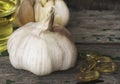 Garlic bulbs on green wooden background Royalty Free Stock Photo