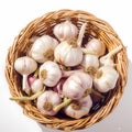 Garlic bulbs neatly arranged in wicker basket on white background Royalty Free Stock Photo