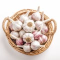 Garlic bulbs neatly arranged in wicker basket on white background Royalty Free Stock Photo