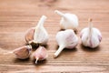 Garlic bulbs whole and lobed on a wooden table. Alternative medicine Royalty Free Stock Photo