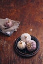 Garlic bulbs on wooden background. Natural antioxidant, anticoagulant, spicy vegetable, healthy diet. Vertical shot, copy space