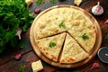 Garlic cheese pizza on wooden board with herbs Royalty Free Stock Photo