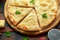 Garlic cheese pizza on wooden board with herbs. Royalty Free Stock Photo