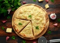 Garlic cheese pizza on wooden board with herbs Royalty Free Stock Photo
