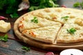 Garlic cheese pizza on wooden board with herbs. Royalty Free Stock Photo