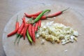 Garlic and chili on chopping block Royalty Free Stock Photo