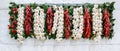 Garlic, chili pepper and laurel leaf in italian flag colors hanging on the wall