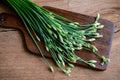 Garlic chives or Allium tuberosum on wooden table Royalty Free Stock Photo