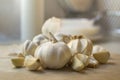 Garlic Cloves and garlic Bulb on chopping board.