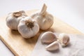 Garlic Cloves and Bulb Garlic on chopping block wooden Royalty Free Stock Photo