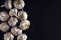 Garlic cloves on dark vintage background.