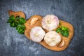 Garlic cloves and garlic bulb on a wooden board on a gray background. Top view Royalty Free Stock Photo