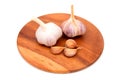 Garlic Cloves and Garlic Bulb on a wooden chopping Board Royalty Free Stock Photo