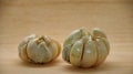 Garlic cloves on rustic in wooden table. Fresh peeled garlics and bulbs.