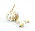 Garlic and cloves on a white background Royalty Free Stock Photo