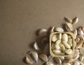 Garlic Cloves in wooden bowl on the MDF wooden plate board Texture Background Royalty Free Stock Photo