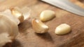 Garlic cloves on a wooden cutting board. Royalty Free Stock Photo