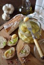 Garlic confit in jar and franch spread bread Royalty Free Stock Photo