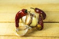 Garlic and dry chili pepper on the background of a wooden table. fresh garlic and dried chili peppers. Dried red pepper Royalty Free Stock Photo