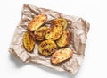 Garlic grilled potatoes baked on a light background top view