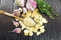 Garlic ground in spoon on dark board top Royalty Free Stock Photo