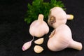 Garlic heads on a black background. Copy space. Royalty Free Stock Photo