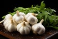 Garlic heads on a black kitchen table, still life