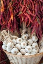 Garlic heads and red chili at market stall