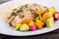 Garlic herb salmon with small vegetables Royalty Free Stock Photo