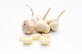 Paddy rice of Thai jasmine rice in basket.Garlic isolated in white background.