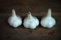 Garlic lies on a wooden table Royalty Free Stock Photo